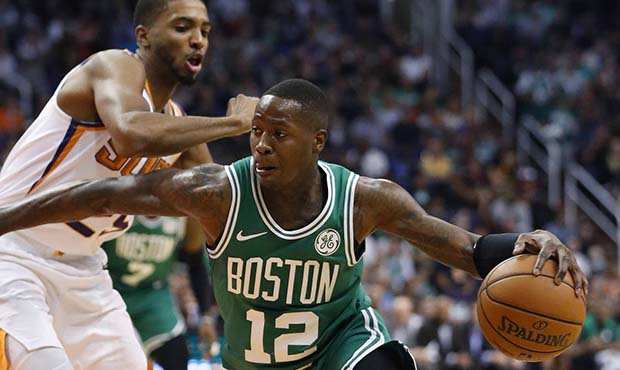 Boston Celtics guard Terry Rozier (12) drives past Phoenix Suns forward Mikal Bridges during the fi...