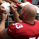 Arizona Cardinals C A.Q. Shipley signs autographs following the team’s Red and White Practice Saturday, August 3, 2019, at State Farm Stadium. (Tyler Drake/Arizona Sports)