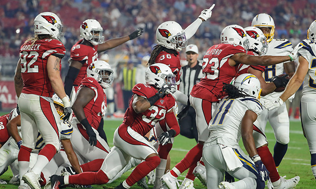 GLENDALE, AZ - AUGUST 08:  The Arizona Cardinals defense points after a turnover during the NFL pre...