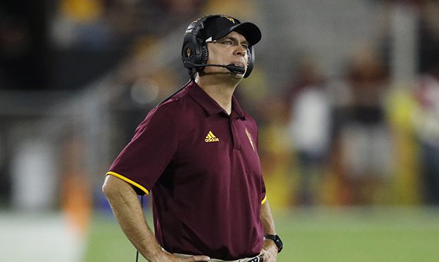Defensive coordinator Danny Gonzales of the Arizona State Sun Devils looks on during the game again...
