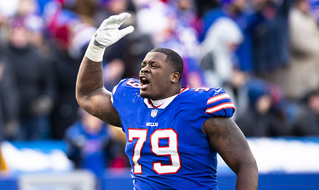Jordan Mills #79 of the Buffalo Bills excites the crowd after being ejected during the third quarte...