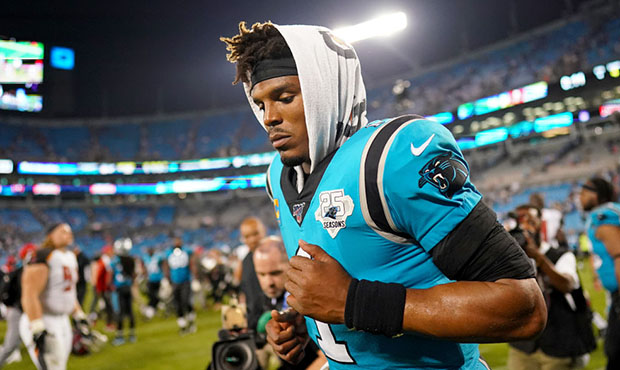 Cam Newton #1 of the Carolina Panthers runs off the field after their game against the Tampa Bay Bu...