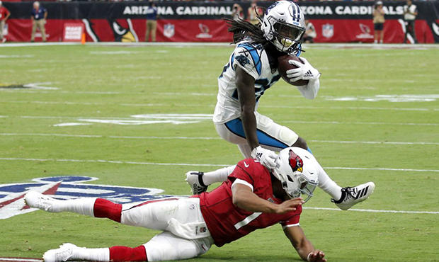 Arizona Cardinals quarterback Kyler Murray (1) tackles Carolina Panthers cornerback Donte Jackson (...