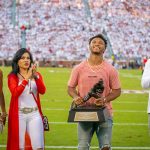 Kyler Murray holds the Heisman Trophy flanked by (from left) his cousin, Carly, his mother, Missy, and his father, Kevin. (Photo by Alex Simon/Cronkite News) 