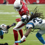Arizona Cardinals wide receiver Christian Kirk (13) is hit by Carolina Panthers defensive back Tre Boston (33) during the first half of an NFL football game, Sunday, Sept. 22, 2019, in Glendale, Ariz. (AP Photo/Ross D. Franklin)