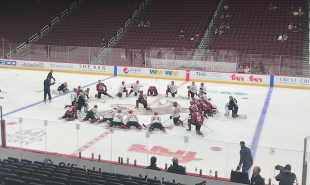 Coyotes rookies stretch at the team's rookie camp at Gila River Arena in Glendale, Ariz. on Sept. 5...
