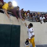 Arizona State quarterback Jayden Daniels celebrates with fans following an NCAA college football game against Michigan State, Saturday, Sept. 14, 2019, in East Lansing, Mich. (AP Photo/Al Goldis)