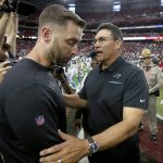 Carolina Panthers head coach Ron Rivera, right, greets Arizona Cardinals head coach Kliff Kingsbury after an NFL football game, Sunday, Sept. 22, 2019, in Glendale, Ariz. The Panthers won 38-20. (AP Photo/Ross D. Franklin)