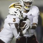 Arizona State's Jayden Daniels, right, hands off the ball to Eno Benjamin (3) in the second half of an NCAA college football game against California, Friday, Sept. 27, 2019, in Berkeley, Calif. (AP Photo/Ben Margot)