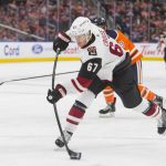 Arizona Coyotes left wing Lawson Crouse (67) shoots and scores against the Edmonton Oilers during the first period of an NHL hockey preseason game Tuesday, Sept. 24, 2019, in Edmonton, Alberta. (Amber Bracken/The Canadian Press via AP