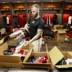 Arizona Diamondbacks' Christian Walker places shoes in boxes while cleaning out his locker after their 1-0 win over the San Diego Padres Sunday, Sept. 29, 2019, in Phoenix. The Arizona Diamondbacks finished the season with 85 wins and 77 loses. (AP Photo/Darryl Webb)