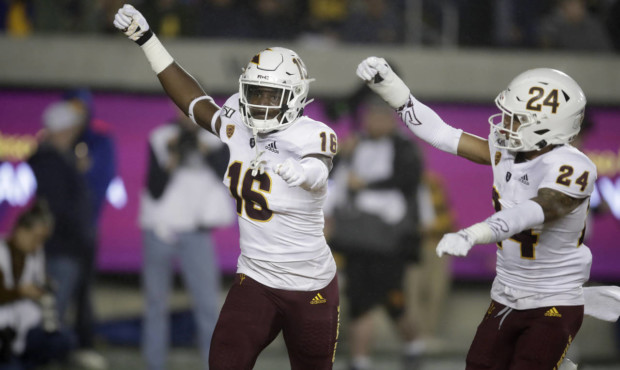 Arizona State's Aashari Crosswell, left, celebrates with Chase Lucas (24) after intercepting a pass...