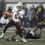 Arizona State quarterback Jayden Daniels (5) evades the tackle of California's Cameron Goode in the second half of an NCAA college football game, Friday, Sept. 27, 2019, in Berkeley, Calif. (AP Photo/Ben Margot)