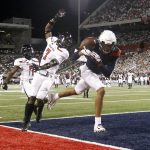 Arizona wide receiver Drew Dixon (1) attempts to catch a pass in the end zone as Texas Tech defensive back Adrian Frye (7) defends during the first half of an NCAA college football game, Saturday, Sept. 14, 2019, in Tucson, Ariz. (AP Photo/Ralph Freso)