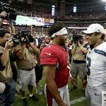 Seattle Seahawks quarterback Russell Wilson (3), right, and Arizona Cardinals quarterback Kyler Murray (1) meet after an NFL football game, Sunday, Sept. 29, 2019, in Glendale, Ariz. The Seahawks won 27-10. (AP Photo/Ross D. Franklin)