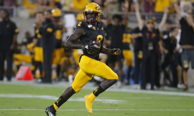 Arizona State wide receiver Brandon Aiyuk scores a touchdown against Colorado after losing his righ...