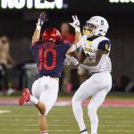 Arizona cornerback Malcolm Holland (10) defends the pass intended for Northern Arizona wide receiver Stacy Chukwumezie in the first half during an NCAA college football game, Saturday, Sept. 7, 2019, in Tucson, Ariz. (AP Photo/Rick Scuteri)