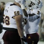 Arizona State's Eno Benjamin, right, celebrates with Alex Losoya (56) after scoring a touchdown against California in the first half of an NCAA college football game, Friday, Sept. 27, 2019, in Berkeley, Calif. (AP Photo/Ben Margot)