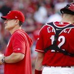 Cincinnati Reds manager David Bell, left, stands on the mound after relieving starting pitcher Luis Castillo (58) in the eighth inning of a baseball game against the Arizona Diamondbacks, Saturday, Sept. 7, 2019, in Cincinnati. (AP Photo/John Minchillo)