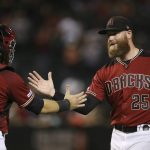 Arizona Diamondbacks relief pitcher Archie Bradley (25) celebrates with catcher Alex Avila, left, after the final out of the team's baseball game against the San Diego Padres on Wednesday, Sept. 4, 2019, in Phoenix. The Diamondbacks won 4-1. (AP Photo/Ross D. Franklin)
