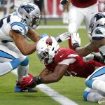 Arizona Cardinals running back David Johnson (31) dives in for the touchdown as Carolina Panthers strong safety Eric Reid (25) and outside linebacker Shaq Thompson (54) defends during the second half of an NFL football game, Sunday, Sept. 22, 2019, in Glendale, Ariz. (AP Photo/Rick Scuteri)