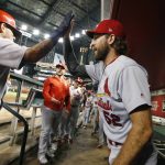 St. Louis Cardinals' Yadier Molina, left, celebrates his two-run home run against the Arizona Diamondbacks with teammate Michael Wacha (52) during the fifth inning of a baseball game Monday, Sept. 23, 2019, in Phoenix. (AP Photo/Ross D. Franklin)