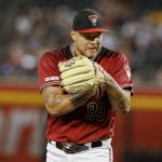 Arizona Diamondbacks' Taijuan Walker claps as he comes off the mound against the San Diego Padres during the first inning of a baseball game Sunday, Sept. 29, 2019, in Phoenix. Walker made his first appearance on a Major League mound since April 14, 2018. Walker threw 15 pitches, eleven for strikes in his only inning of pitching. (AP Photo/Darryl Webb)