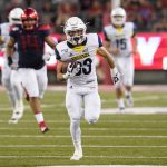Northern Arizona wide receiver Riley Langton (83) scores a touchdown against Arizona in the second half during an NCAA college football game, Saturday, Sept. 7, 2019, in Tucson, Ariz. (AP Photo/Rick Scuteri)