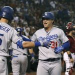 Los Angeles Dodgers' Joc Pederson (31) celebrates his home run against the Arizona Diamondbacks with Dodgers' Cody Bellinger (35) during the 11th inning of a baseball game Sunday, Sept. 1, 2019, in Phoenix. The Dodgers defeated the Diamondbacks 4-3. (AP Photo/Ross D. Franklin)