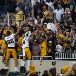 Arizona State players celebrate with fans following an NCAA college football game against Michigan State, Saturday, Sept. 14, 2019, in East Lansing, Mich. (AP Photo/Al Goldis)