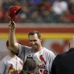 St. Louis Cardinals' Paul Goldschmidt, a longtime Arizona Diamondbacks player, smiles and waves to the cheering crowd as he is introduced during a ceremony prior to a baseball game against the Diamondbacks Monday, Sept. 23, 2019, in Phoenix. (AP Photo/Ross D. Franklin)