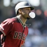 Arizona Diamondbacks' Adam Jones blows a bubble on his way to first base after hitting a two-run home run against the San Diego Padres during the second inning of a baseball game in San Diego, Sunday, Sept. 22, 2019. (AP Photo/Alex Gallardo)