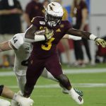 Arizona State running back Eno Benjamin (3) is chased down by Sacramento State defensive lineman Josiah Erickson (44) during the first half of an NCAA college football game Friday, Sept. 6, 2019, in Tempe, Ariz. (AP Photo/Matt York)