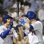 New York Mets' Brandon Nimmo (9) and Todd Frazier (21) celebrate at the plate after Frazier's solo home run during the third inning of the team's baseball game against the Arizona Diamondbacks, Wednesday, Sept. 11, 2019, in New York. (AP Photo/Kathy Willens)