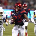Arizona running back Gary Brightwell (23) scores a touchdown against Northern Arizona in the first half during an NCAA college football game, Saturday, Sept. 7, 2019, in Tucson, Ariz. (AP Photo/Rick Scuteri)