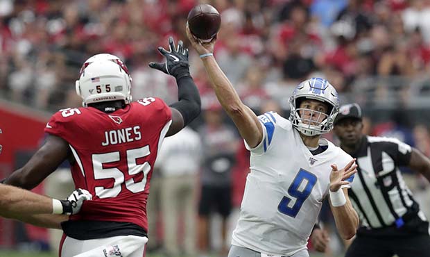 Detroit Lions quarterback Matthew Stafford (9) throws as Arizona Cardinals linebacker Chandler Jone...