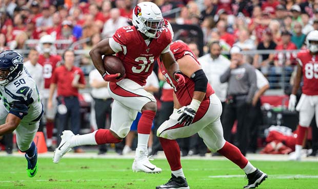 Running back David Johnson #31 of the Arizona Cardinals runs with the ball in the first half of the...
