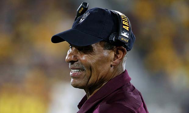 Arizona State coach Herm Edwards watches from the sideline during the first half of the team's NCAA...