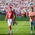 Former Oklahoma quarterback Kyler Murray (right) stands next to current Oklahoma quarterback Spencer Rattler (7) as Rattler warms up for the first game of the 2019 season. (Photo by Alex Simon/Cronkite News)