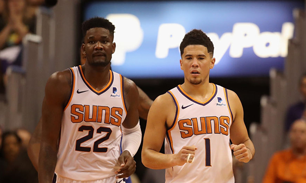 Devin Booker #1 and Deandre Ayton #22 of the Phoenix Suns during the NBA game against the Dallas Ma...