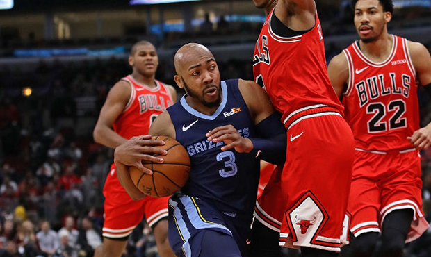 Jevon Carter #3 of the Memphis Grizzlies moves against Shaquille Harrison #3 of the Chicago Bulls a...