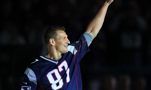 Former New England Patriots player Rob Gronkowski looks to the crowd before the game between the Ne...
