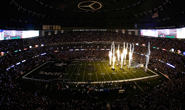 The New Orleans Saints take the field before a game against the Houston Texans at the Mercedes Benz...