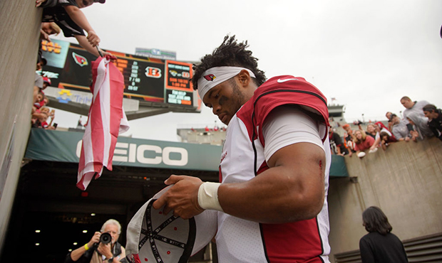 Kyler Murray #1 of the Arizona Cardinals signs an autograph for a fan after the game against the Ci...