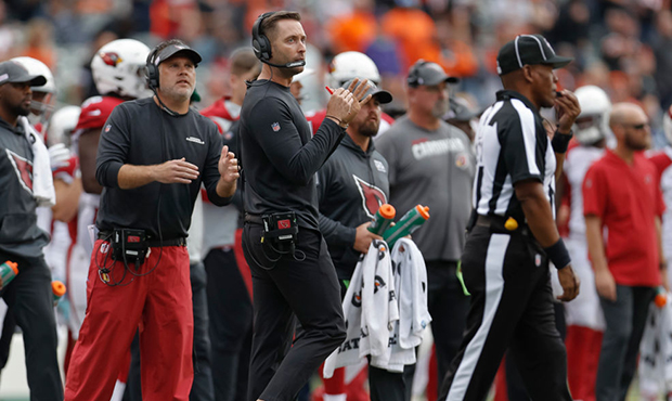 Head coach Kliff Kingsbury of the Arizona Cardinals watches the clock and calls a time out late in ...