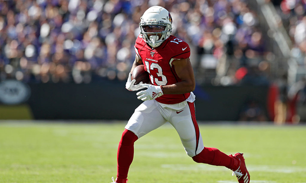 Wide Receiver Christian Kirk #13 of the Arizona Cardinals runs with the ball against the Baltimore ...