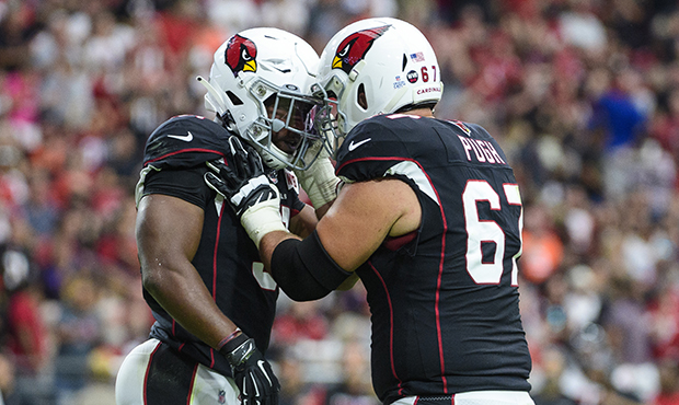 Running back David Johnson #31 of the Arizona Cardinals celebrates a touchdown with offensive guard...