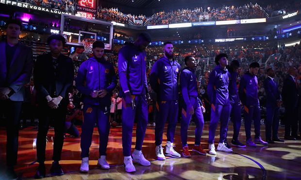 The Phoenix Suns stand attended for the national anthem before NBA game against the Sacramento King...