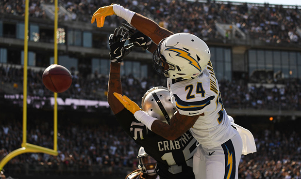Trevor Williams #24 of the Los Angeles Chargers defends a pass intended for Michael Crabtree #15 of...