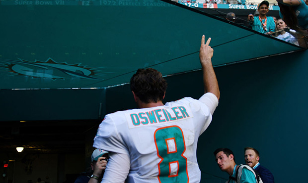 MIAMI, FL - OCTOBER 14:  Brock Osweiler #8 of the Miami Dolphins celebrates as he walks off of the ...